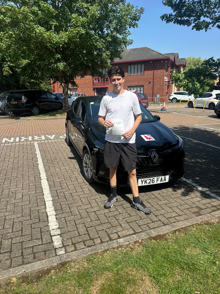 Student celebrating practical driving test pass