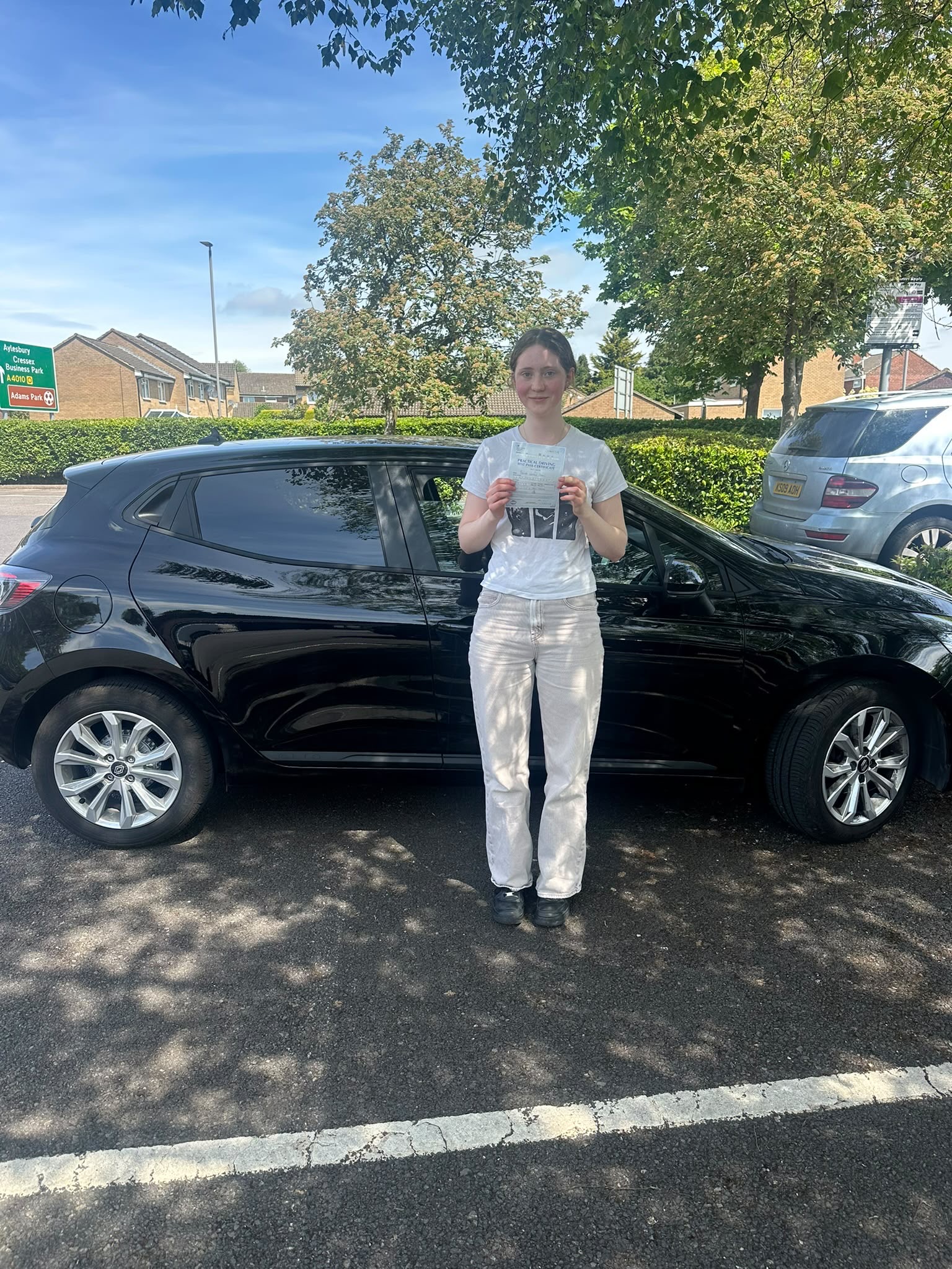 Student holding DVSA practical test pass certificate in High Wycombe